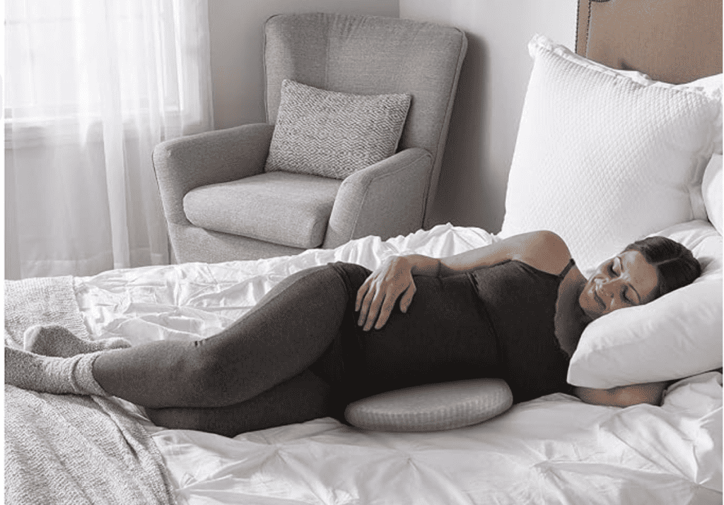 pregnant woman resting with a wedge pillow